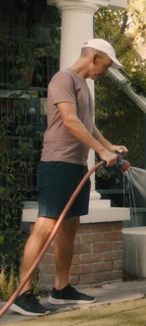 man watering plants